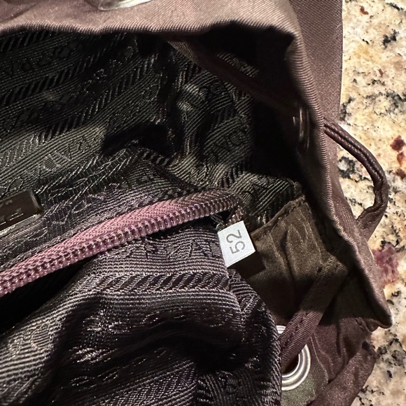 Prada backpack. Pre loved. Brown in color. Pockets inside and outside. - Picture 5 of 12